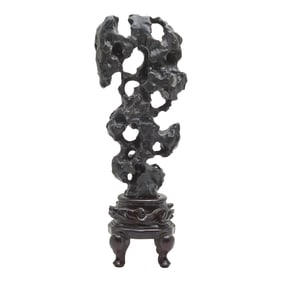 A Chinese Lingbi Scholar's Stone with a Wooden Stand