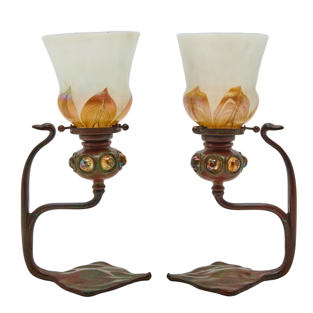 Pair of Tiffany Studios Candlesticks with Glass Shades: Pair of Tiffany Studios Candlesticks with Glass Shades, with curved flattened tubular handles,and stylized lily pad bases, with the squat globular removable bobechesinset with favrile glass balls, the