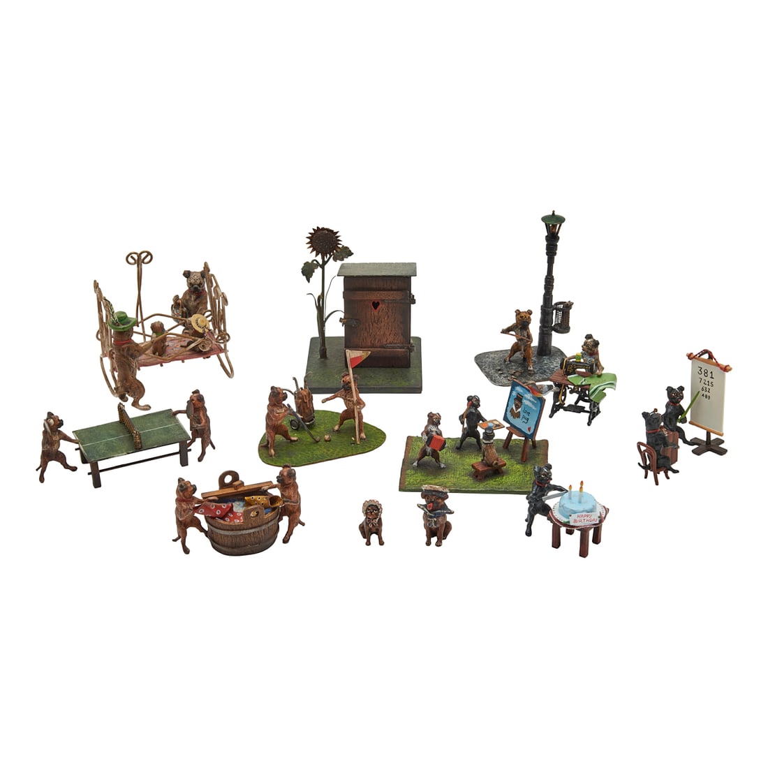 Austrian Cold Painted Bronze MIniature Pug Dogs at Pursuits: Austrian Cold Painted Bronze MIniature Pug Dogs at Pursuits, twelve modelled motifs, including a pair looking at puppies in a crib, ping pong players, washing cloths, golf players, painters, birthday