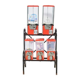 Coin Op Five Dispenser Gumball Capsule Set on Black Metal Stand