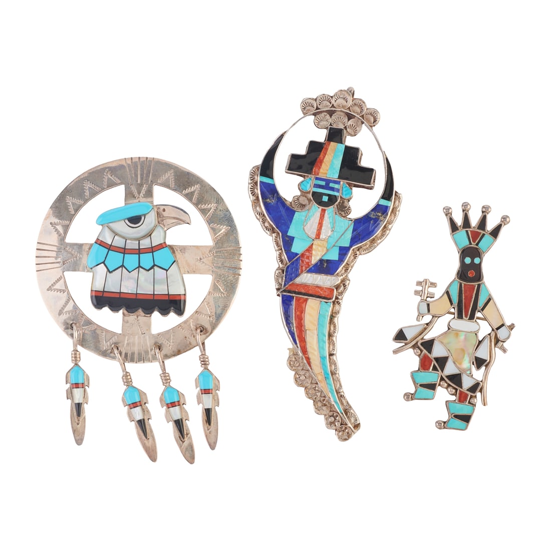*Collection of Three Native American Zuni Multi-Stone Inlay Pendant Brooches: *Collection of Three Native American Zuni Multi-Stone Inlay, Silver Pendant Brooches. Including one E. Martinez lapis lazuli, black onyx, turquoise, coral, mother-of-pearl inlay, silver rainbow man pe