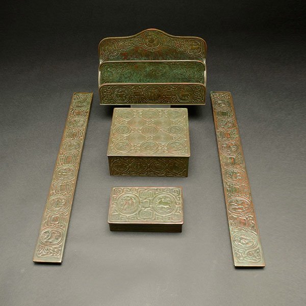 Tiffany Studios Zodiac Pattern Partial Desk Set.: Tiffany Studios Zodiac Pattern Partial Desk Set. Comprised of a pair of blotter ends; a small box marked Tiffany Studios New York 810 measuring 5 3/8 x 3 1/2 x 1 inches; a larger box marked Tiffany St