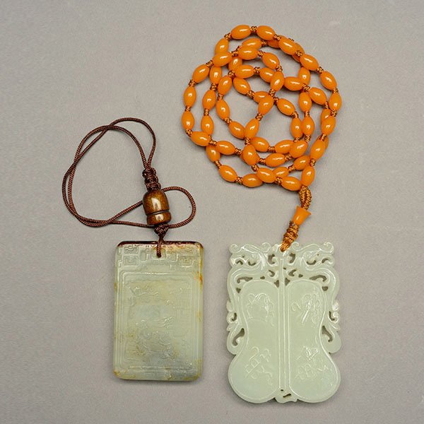 Two Rectangular Jade Plaques: Two Rectangular Jade Plaques, the first of fan form with reticulated dragons to either side; the second with a figural landscape and an inscription {Taller: 2 1/4 inches (5.7 cm)} [Minor chips to seco