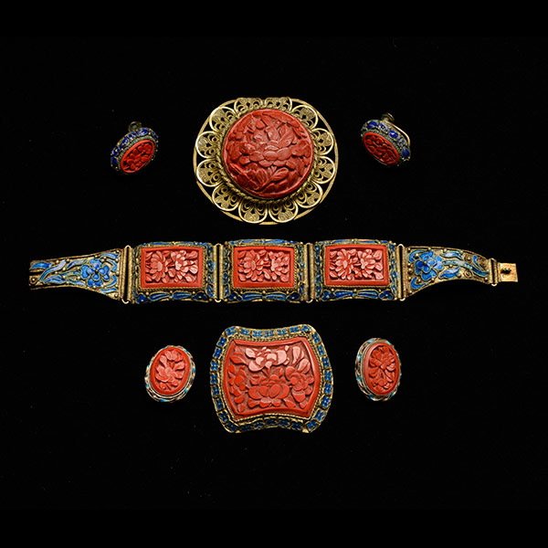 Group of Enameled Metal & Cinnabar Jewelry Pieces: A Group of Enameled Metal and Cinnabar Jewelry Pieces, including a paneled bracelet, two brooches, and two pairs of earrings {Length of Bracelet: 7 inches (17.8 cm)} [Small losses, dents, cracks]