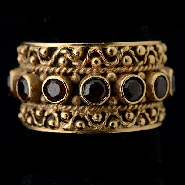 GARNET, 14K YELLOW GOLD RING.: GARNET, 14K YELLOW GOLD RING. Featuring fourteen round-cut garnets, set in a 14k yellow gold mounting. Size 7 1/2, Gross Weight: 5.9 dwts