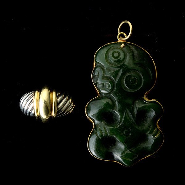 TWO JADE, GOLD, STERLING SILVER JEWELRY ITEMS.: COLLECTION OF TWO JADE, GOLD, STERLING SILVER JEWELRY ITEMS. Including one David Yurman 14k yellow gold, sterling silver ring, size 6 together with one carved nephrite Maori, 14k yellow gold pendant.