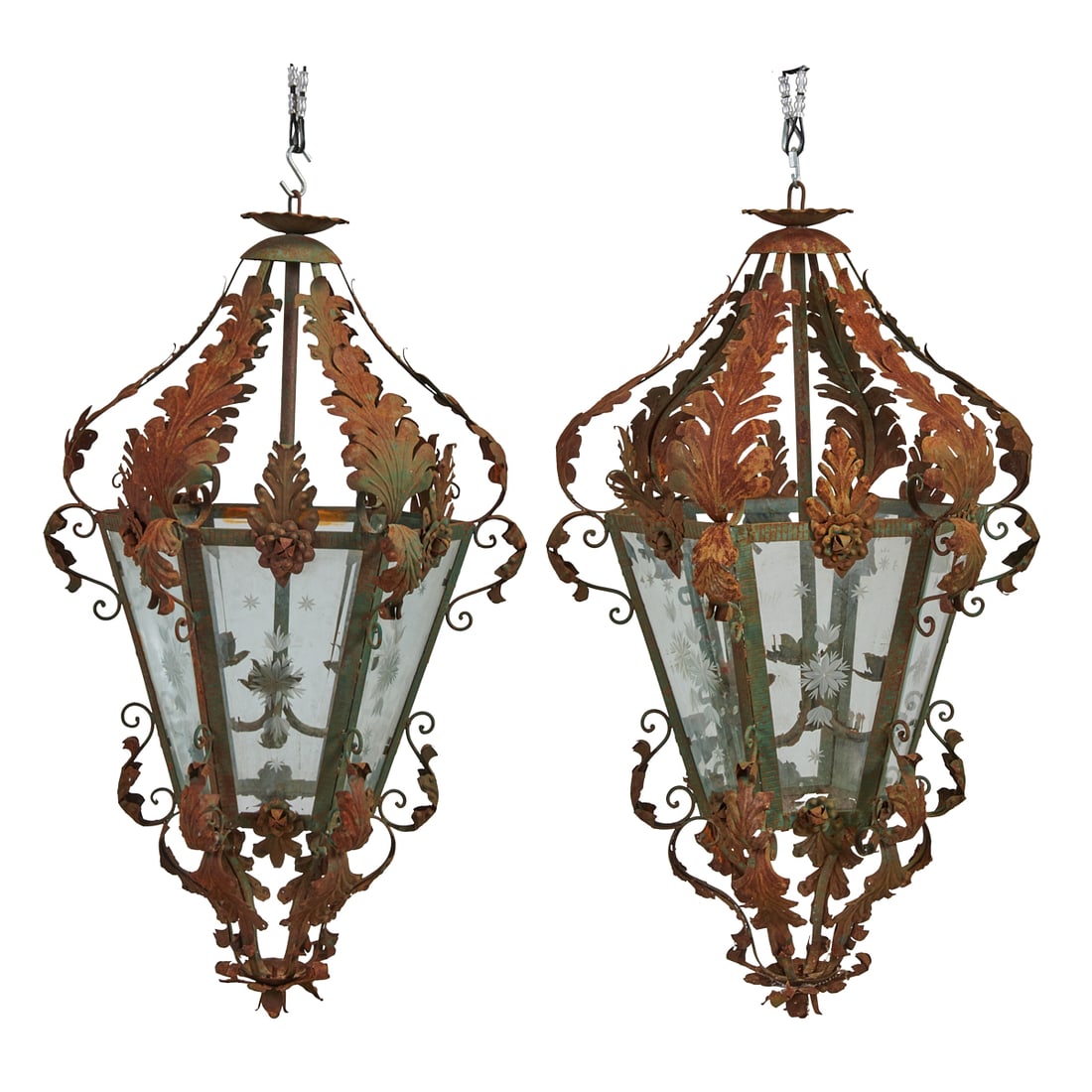 Pair of Spanish Style Wrought Iron and Tole Hexagonal Lanterns with Etched Glass: Pair of Spanish Style Wrought Iron and Tole Hexagonal Lanterns with Etched Glass. {Approximate Dimensions: 48" H x 27" W each.}.