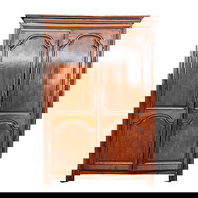 French Provincial Walnut Armoire: French Provincial Walnut Armoire, the crest over two doors, and various interior shelves; the doors with bas relief carved arches and panels. {Approximate dimensions: 91 1/4" high x 65" wide x 27 1/2"