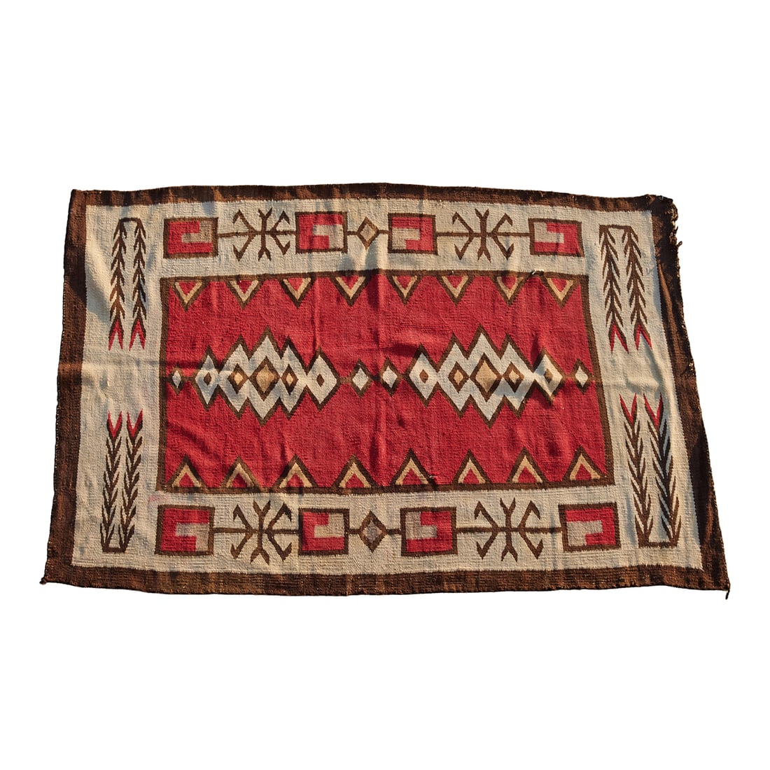 Navajo Dine Rug. 4' 1" by 6': Navajo Dine Rug, red primary field, with stylized lightening motifs in white, brown, and black. The border with stylized foliate and vegetal motifs. {Approximate dimensions: 4' 1" inch by 6'.}.