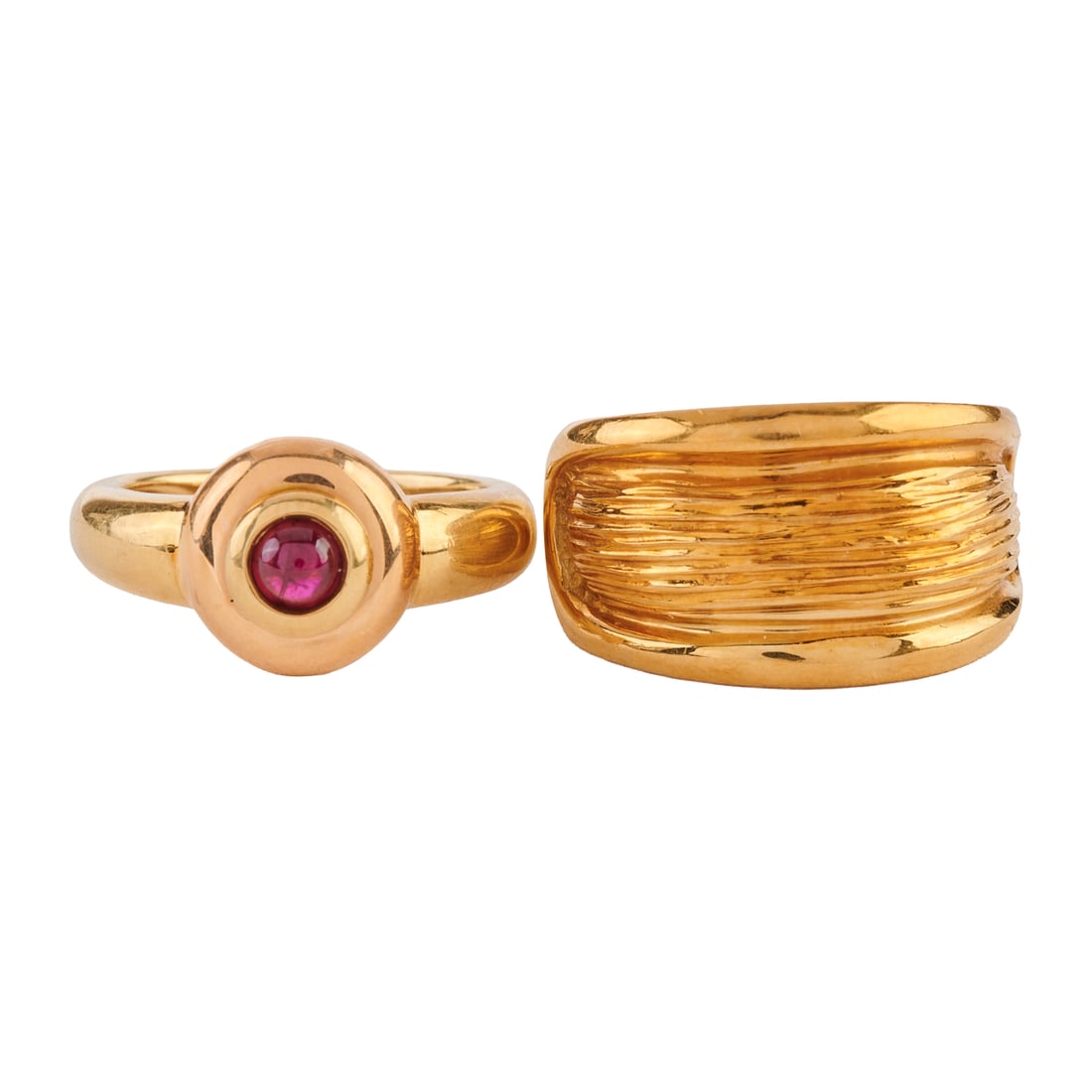 Two Ruby, 18k Yellow Gold Rings: Two Ruby, 18k Yellow Gold Rings. Including one round ruby cabochon, 18k yellow gold ring, size 6 1/2 together with one 18k yellow gold ring measuring approximately 13 mm in width, size 7 1/4. {Gross W