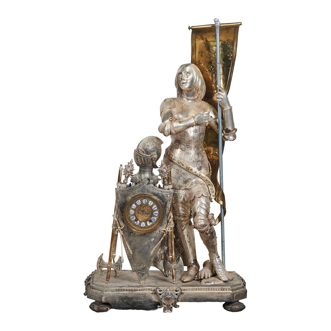 Belle Epoque Silvered St. Joan Figural Clock: Belle Epoque Silvered St. Joan Figural Clock. The large figure with shield inset with French blue enamel clock. Circa 1890 - 1900.{Approximate dimensions: 42 1/2" high x 24 1/4" wide x 11" deep.}