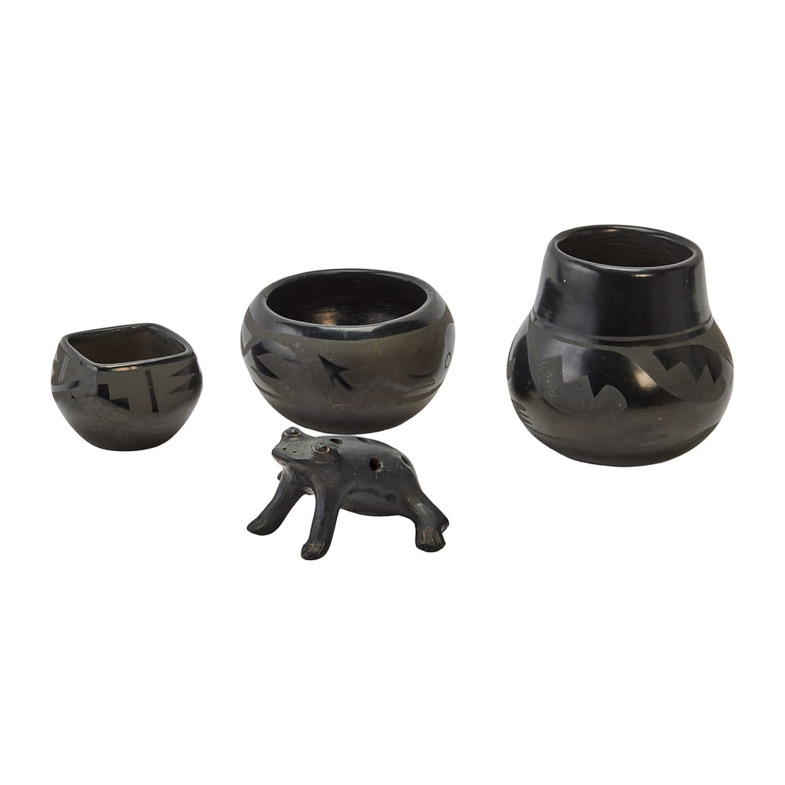 Four Santa Clara Black Stoneware Articles: Four Santa Clara Black Stoneware, comprising three vessels and a figure of a frogTwo unmarked to underside bases, the small faceted vessel marked to underside with Sophie Cata / Santa Clara / Pue.