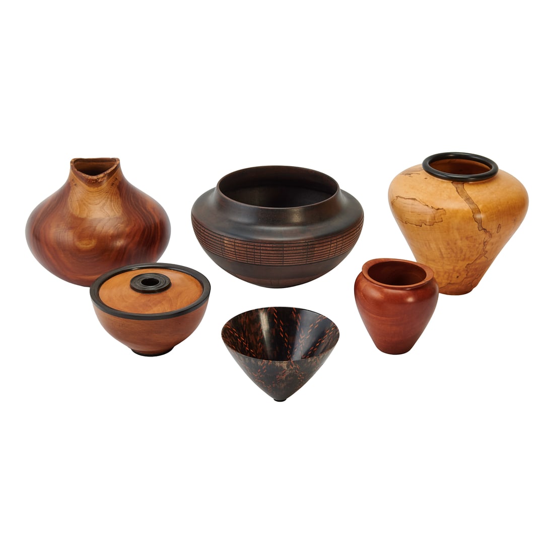 American Craft: Six Carved and Turned Vessels: American Craft: Six Carved and Turned Vessels, including a vase of spalted soft maple and ebony by Gene Short, a pistachio wood vase by Michael Peterson, a segmented bowl of ebony and tulipwood by
