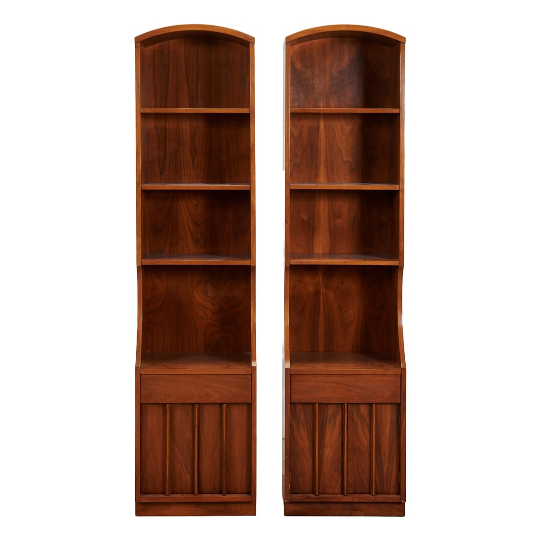 Pair of Century Attributed Mid Century Modern Walnut Bookcases: Pair of Century Attributed Mid Century Modern Walnut Bookcases, arched tops over three shelves, lower sections with curve-cuts over single drawer, over pair of blind doors. Stencilled to back, "6010