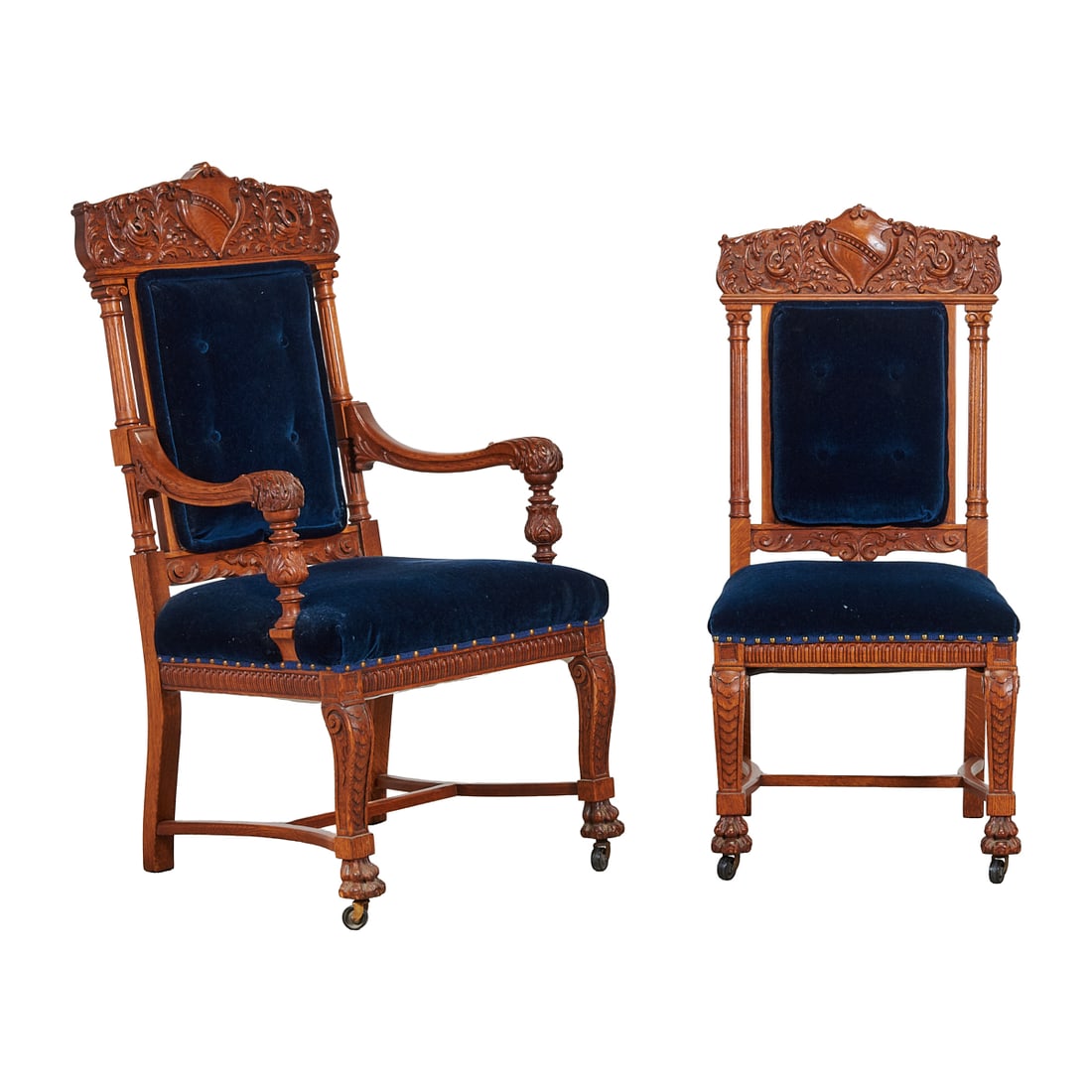 Suite of Six Renaissance Revival Oak Dining Chairs: Suite of Six Renaissance Revival Oak Dining Chairs,splats carved with shield devices, scrolling foliage, the armrest fronts with foliate carving over turned supports, front legs chip carved