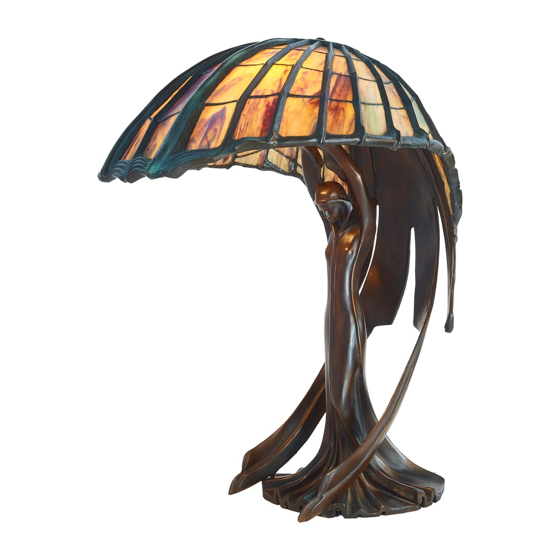 After Peter Behrens "Flying Lady" Bronze and Stained Glass Figural Lamp: After Peter Behrens "Flying Lady" Bronze and Stained Glass Figural LampScratch incised BEHRENS and 1/ to base, rear.{Approximate dimensions: