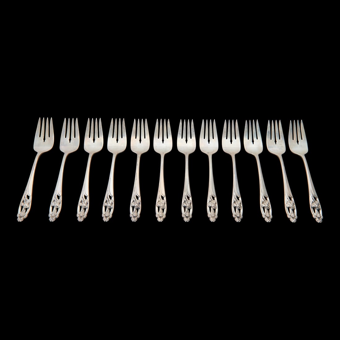 Towle Silver Co Iris Pattern Sterling Silver Forks: Towle Silver Co Iris Pattern Sterling Silver Forks Comprising twelve salad forks, each with pierced handle design featuring two irises to underside with INTERNATIONAL, anchor, STERLING, Silver