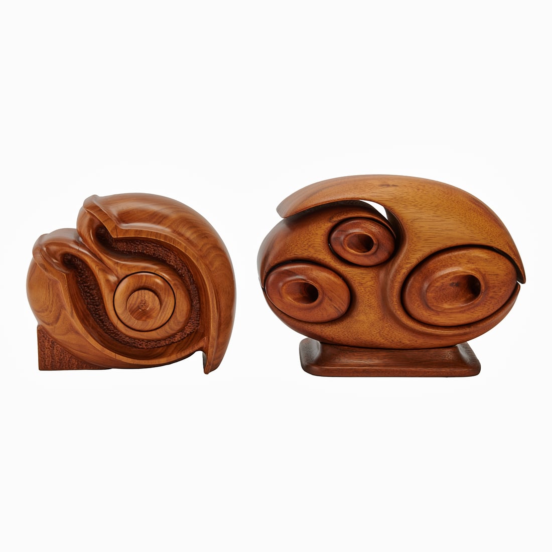 Two Michael Graham Sculptural McCallister Boxes: Two Michael Graham Sculptural McCallister Boxes, "Self Return #1," of pau ferro, on base, dated 1976 and "The Large Within the Small Without #1," of koa wood, dated 1975. Signed in Dremmel to base