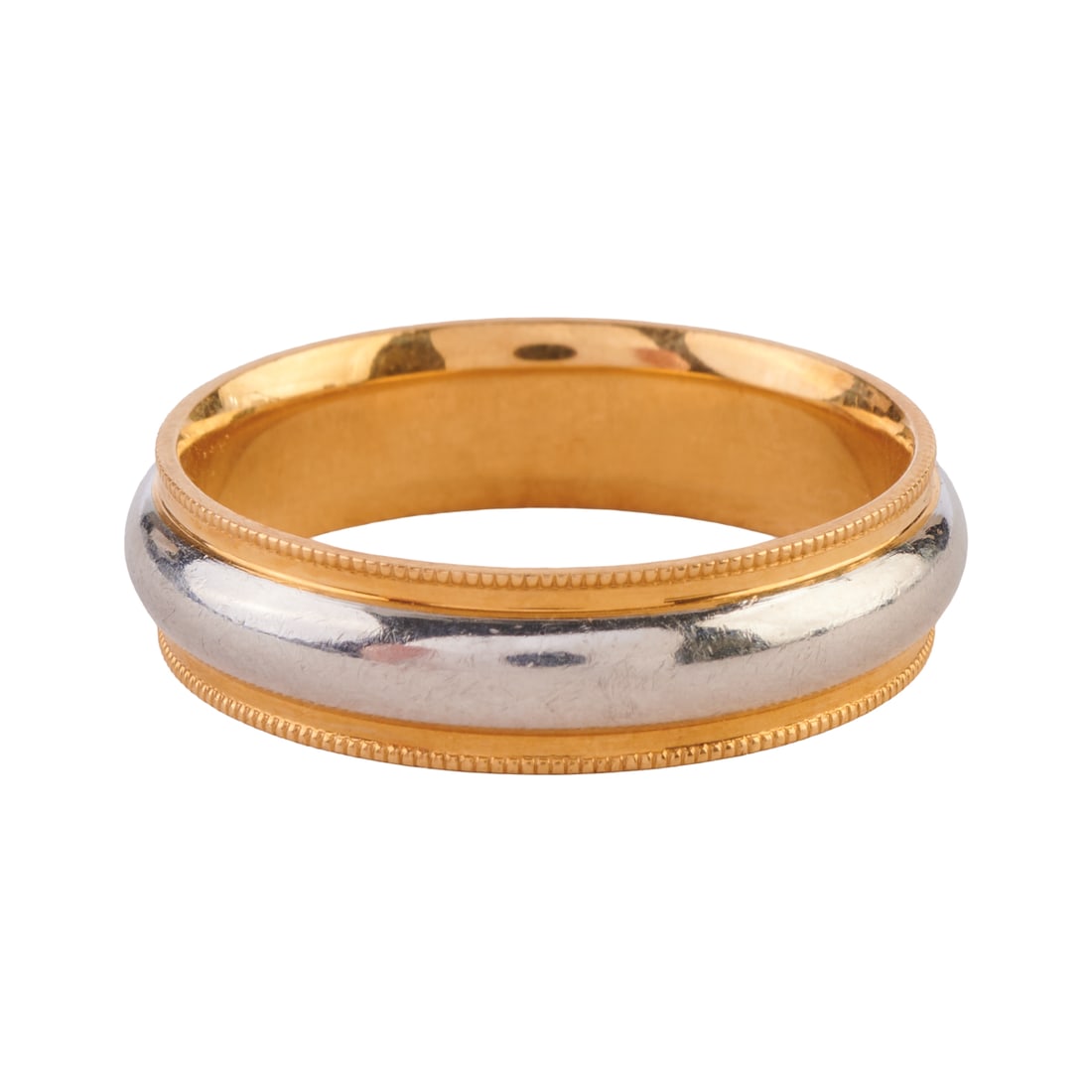 Platinum and 18k Yellow Gold Band: Platinum and 18k Yellow Gold Band. The band featuring a central platinum strip, atop an 18k yellow gold mounting measuring approximately 6 mm in width. {Size: 10 1/4, Gross Weight: 6.4 dwts}