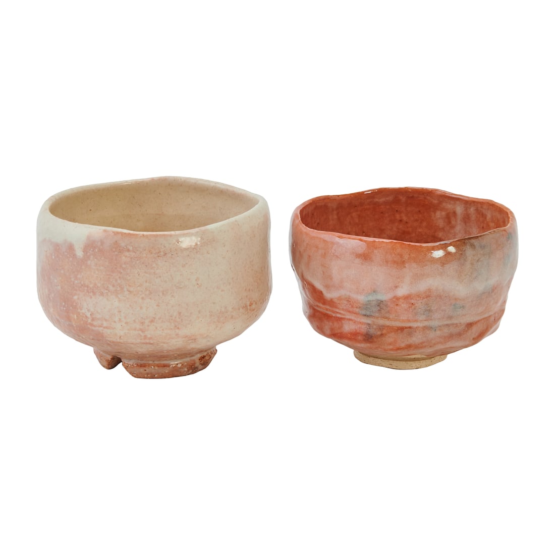 Two Japanese Hagi Ware Tea Bowls, Chawan with Boxes: Two Japanese Hagi Ware Tea Bowls, Chawanwith Boxes. Each with soft, thick glaze and natural kiln effects characteristic of Hagi ceramics. One bowl with a warm reddish glaze with milky white areas and