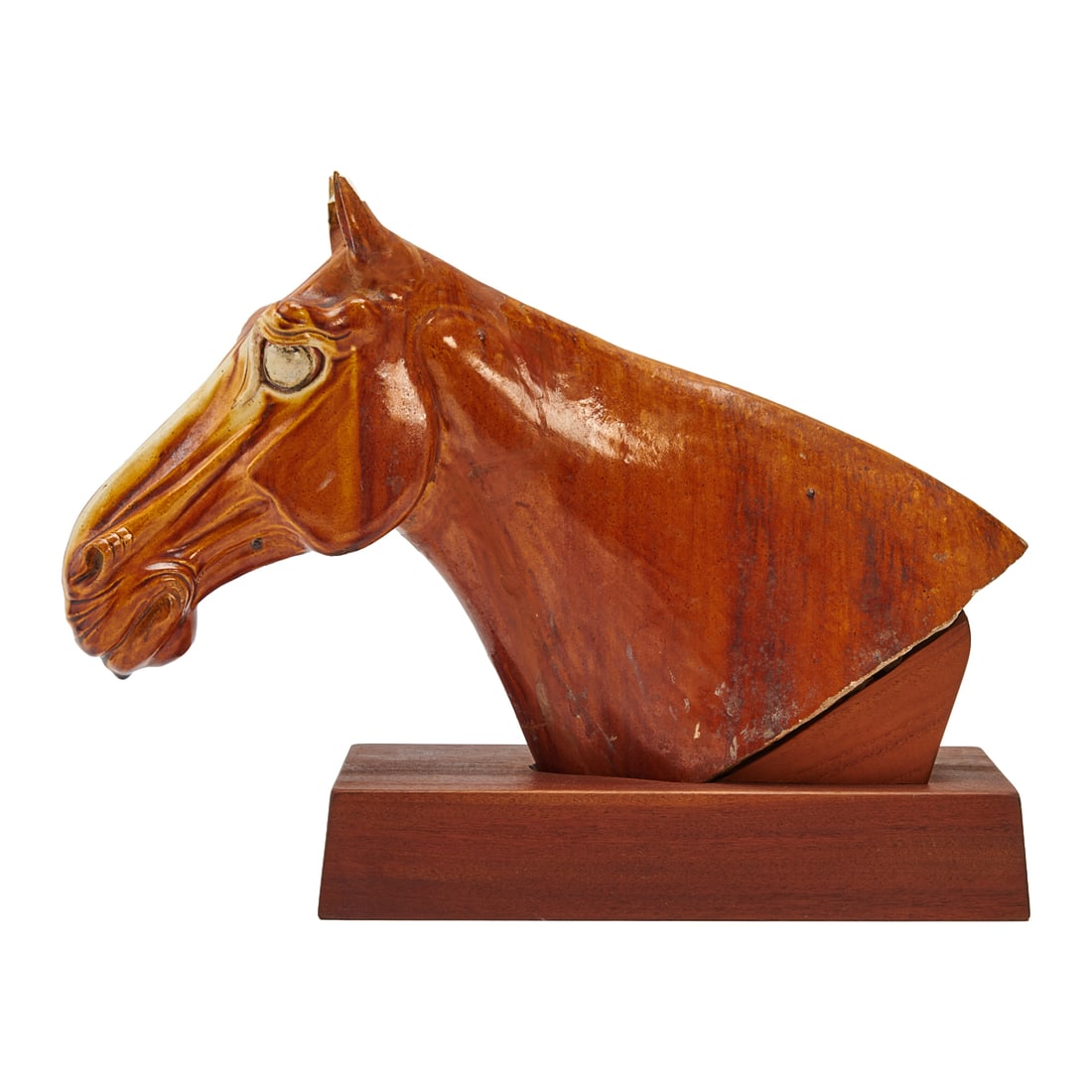 Chinese Tang Glazed Horse Head on Base: Chinese Tang Glazed Horse Head on Base. Modeled as the head and neck of a horse with elongated muzzle, flared nostrils, and stylized mane, the surface covered in a mottled amber-brown glaze pooling