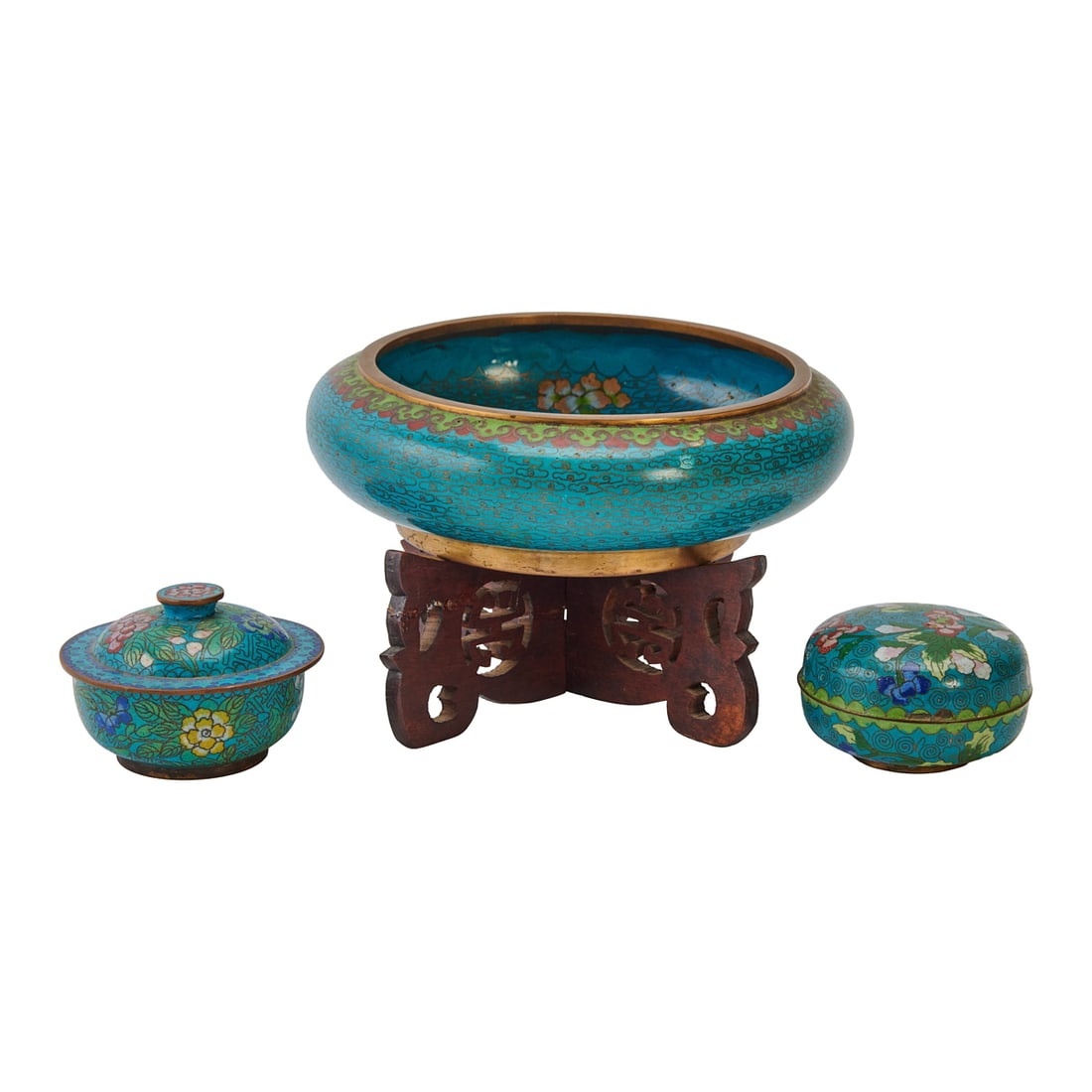 Group of Chinese Cloisonne Enamel Bowls with Covers and Stand: Group of Chinese Cloisonne Enamel Bowls with Covers and Stand.Comprising a large circular bowl raised on a carved wood stand and two smaller covered bowls. Each decorated with scrolling floral and