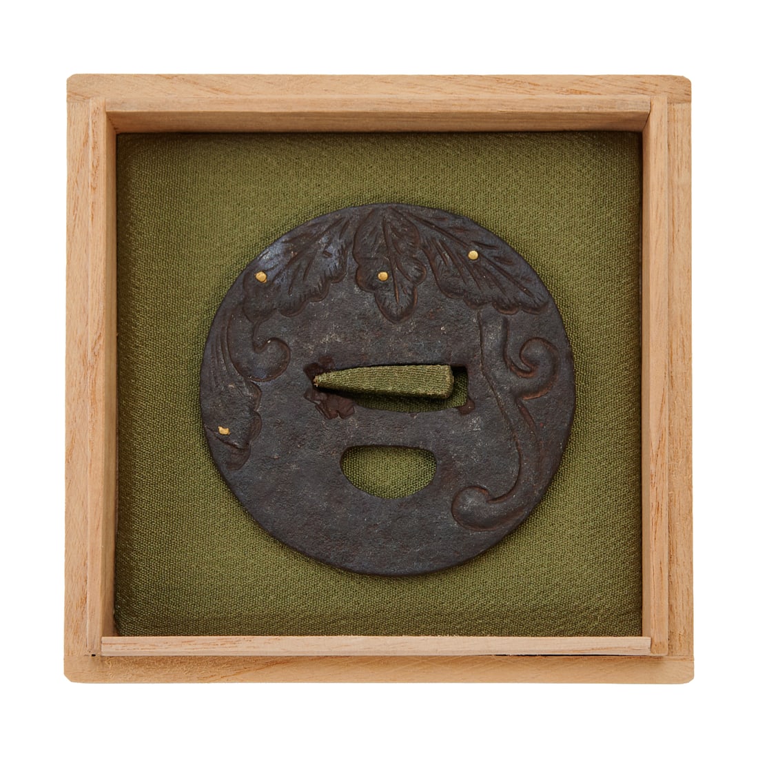 Japanese Heianjo Zogan Iron Tsuba: Japanese Heianjo Zogan Iron Tsuba.Iron sword guard of circular form with carved foliate scroll decoration and brass inlaid accents in the Heianjozogan style. The surface with dark patina and pierced