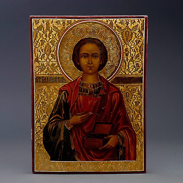 Russian Icon of Saint Pantelemon Icon: Russian Icon of Saint Pantelemon Icon. The figure of the Patron Saint depicted holding a spoon in his right hand, holding a box in his left, his head against a gilt tooled and enameled halo, the gilt 