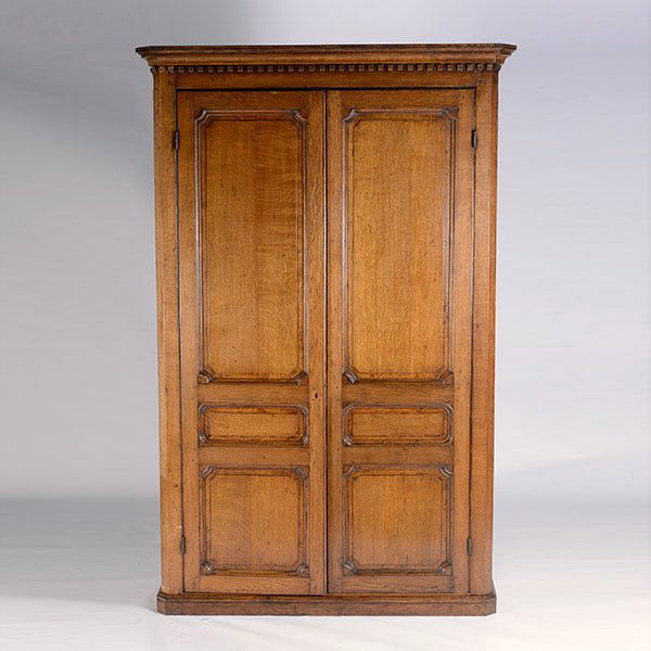 Northern Italian Baroque Walnut Cassonette: Northern Italian Baroque Walnut Cassonette. An outswept molded cornice over twin paneled doors with fluted stiles, opening to reveal a fitted interior with shelf over six drawers, on a molded platform