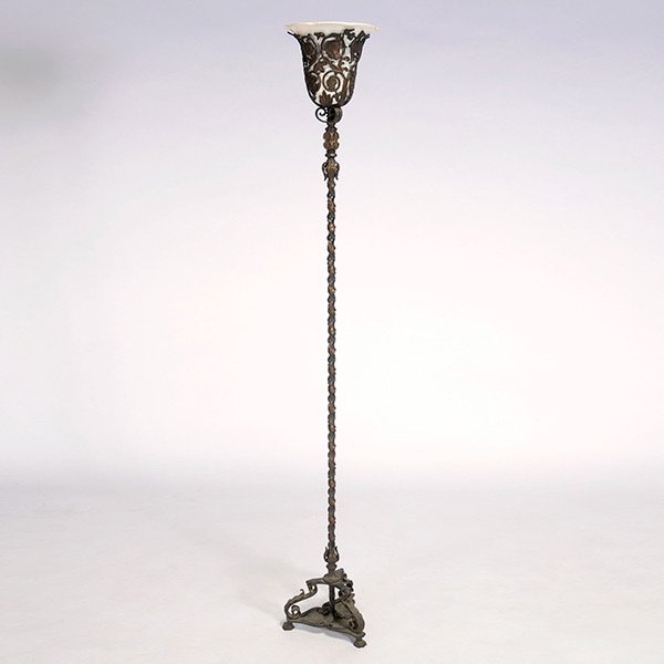 Art Deco Bronze Torchiere Floor Lamp: Art Deco Bronze Torchiere Floor Lamp. The barley twist standard surmounted by a reticulated inverted bell form surround, the cage form frame cast with flora and fauna medallions joined by a scrolling 