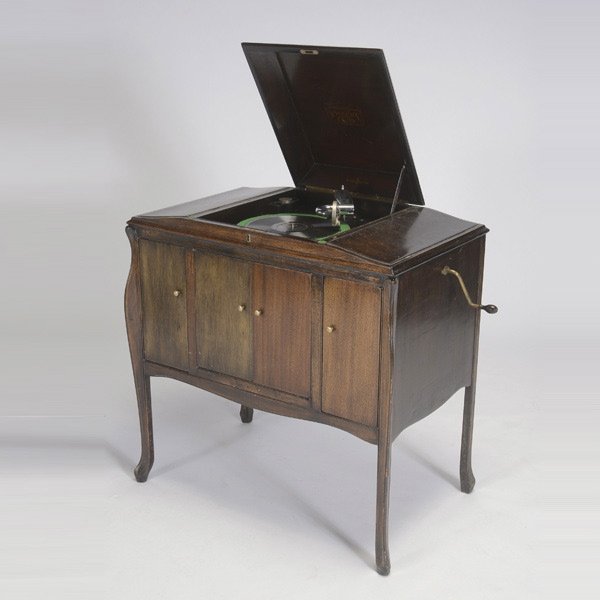 Sherman and Clay Phonograph with Records: Sherman and Clay Phonograph, in oak four door console, with records {Dimensions 35 x 33 1/2 x 20 inches}