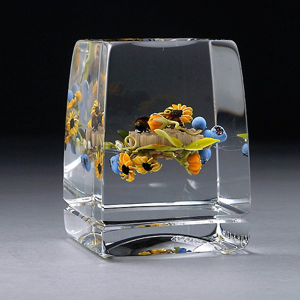 Paul Stankard Botanical Study Vertical Paperweight,: Paul Stankard Botanical Study Vertical Paperweight, on a clear ground featuring spray of black-eyed susans, blueberries, honeycomb, bees, incised above foot "Paul J. Stankard S1 S93". {Dimensions 3 1/