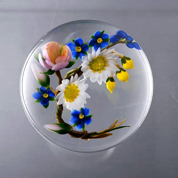 Paul Stankard Braided Spring Bouquet Paperweight: Paul Stankard Braided Spring Bouquet Paperweight composed of daisies, forget-me-nots and a wild rose on a clear ground, "S" signature cane incised "B704 1982". {Height 2 inches; diameter 3 inches}
