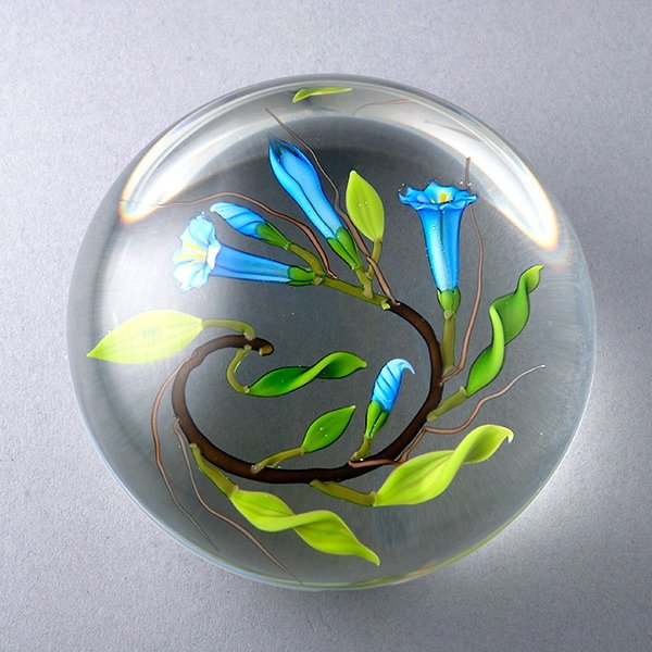 Chris Buzzini Blue Tuberose Paperweight: Chris Buzzini Blue Tuberose Paperweight on a clear ground, incised "Buzzini 87 HBmb21" {Height 2 inches; diameter 3 inches}