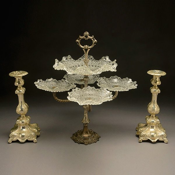 Pair of Silverplate Candlesticks and an Epergne,: Pair of Silverplate Candlesticks and an Epergne, fitted with ruffled glass dishes {Height of epergne 19 1/2 inches}