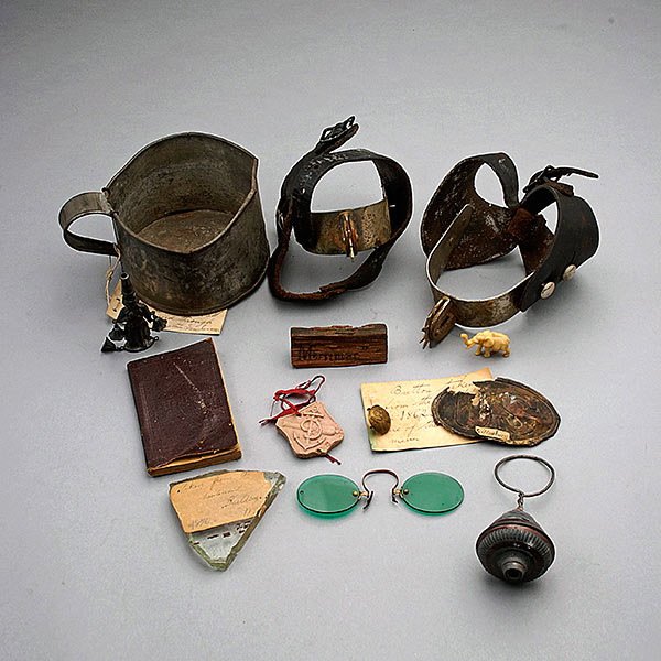 Collection of Civil War Solider Necessities: Collection of Civil War Solider Necessities: Including a pair of spurs, a "US" belt buckle salvaged from Gettysburg, an eagle brass button from a battlefield in 1862; a tin cup; a figural whistle; a r