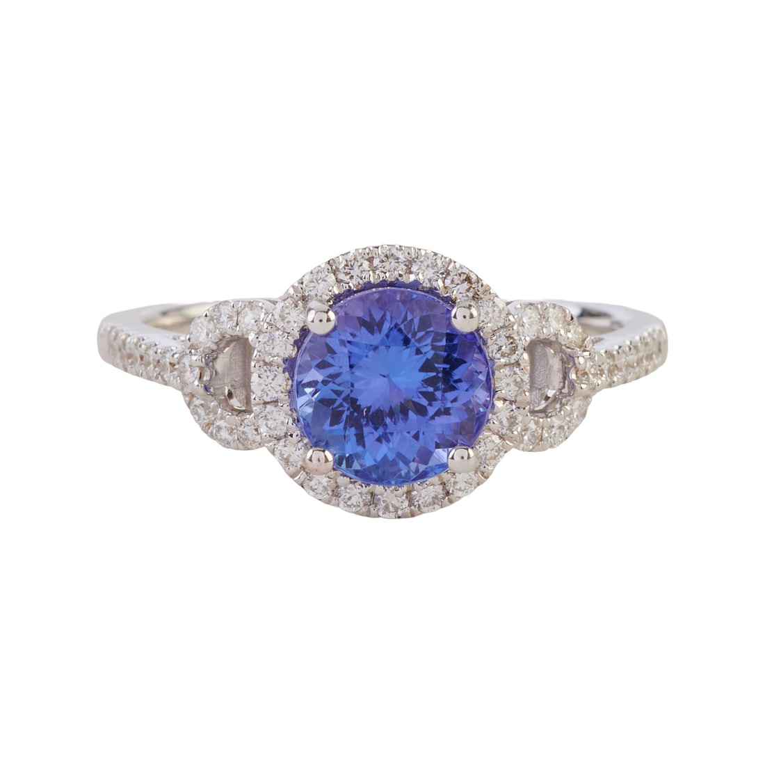 Tanzanite, Diamond, 18k White Gold Ring: Tanzanite, Diamond, 18k White Gold Ring. Featuring one round-cut tanzanite weighing approximately 1.35 ct., accented by forty-six full-cut diamonds weighing a total of approximately 0.20 cttw., set in