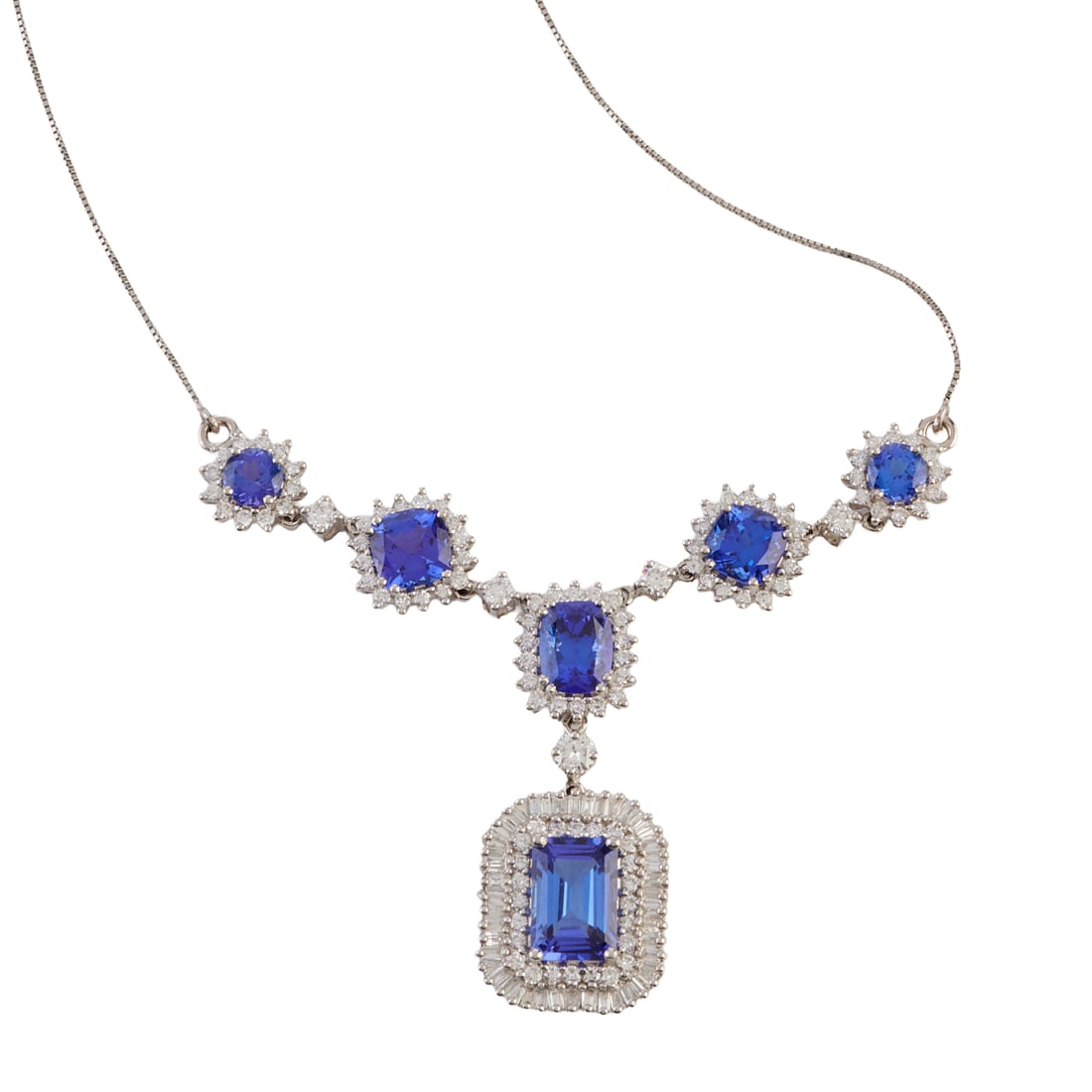 Rhapsody Tanzanite, Diamond, Platinum Necklace: Rhapsody Tanzanite, Diamond, Platinum Necklace. Featuring one emerald-cut, one oval shaped cushion-cut, two square cushion-cut and two round-cut tanzanites weighing a total of approximately 9.00 cttw.