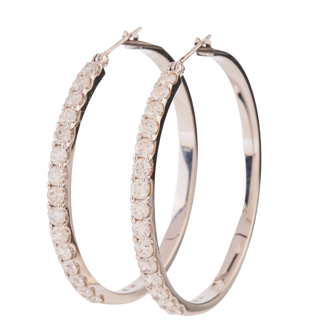 Pair of Diamond, 14k White Gold Hoop Earrings: Pair of Diamond, 14k White Gold Hoop Earrings. Each featuring fifteen full-cut diamonds weighing a total of approximately 1.25 cttw., set in a 14k white gold hoop mounting measuring approximately 40