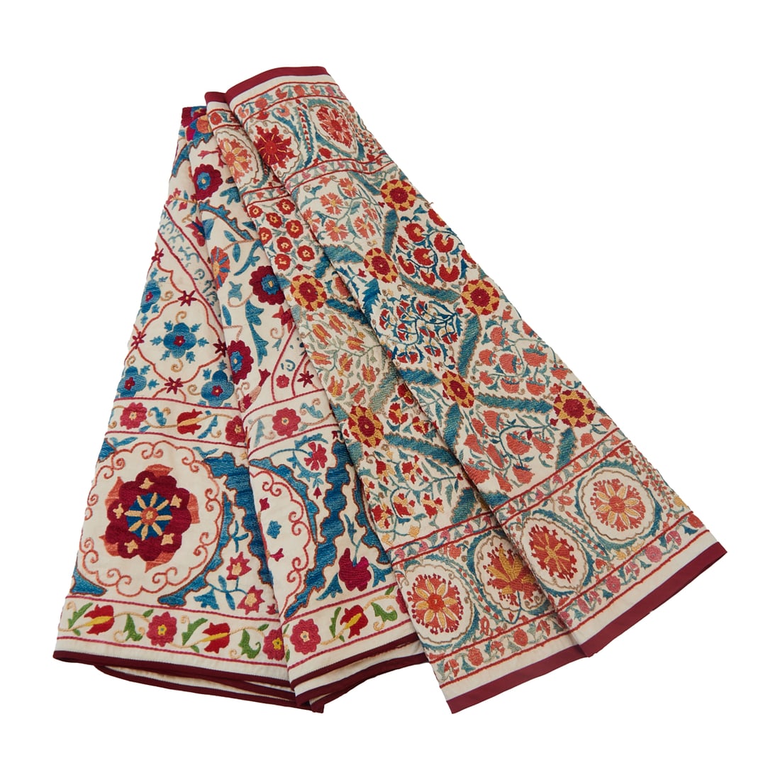 Two Bukhara or Uzbek Silk on Cotton Susani Embroidered Panels: Two Bukhara or Uzbek Silk on Cotton Susani Embroidered Panels, the white cotton grounds embroidered with pinwheels, flowers, foliate designs and strapwork; one centering a medallion motif and with