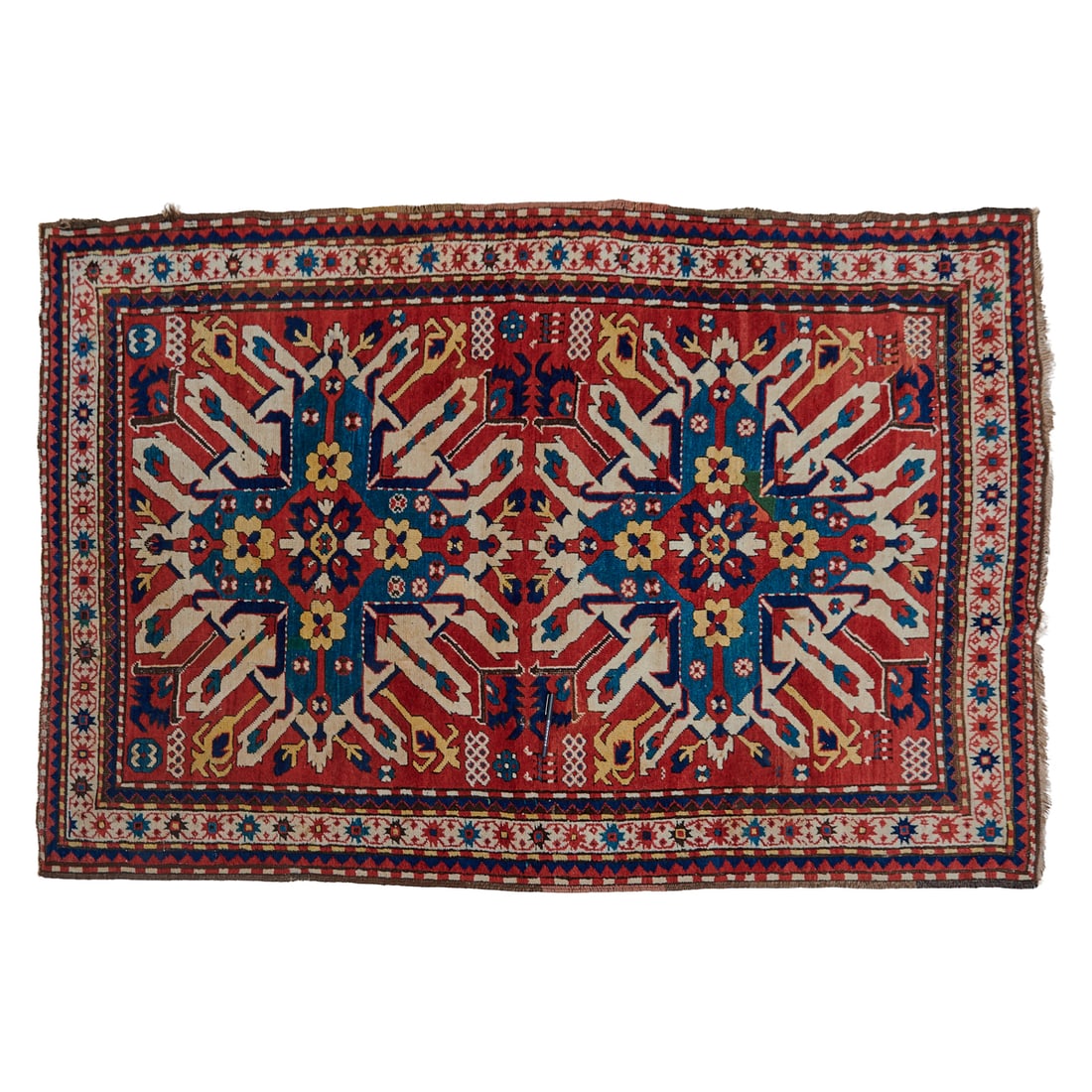 Caucasian Eagle Kazak Chelaberd Rug: Caucasian Eagle Kazak Chelaberd Rug, woven in wool, the red field woven with two vibrant guls of white, green-blue, deep blue, and yellow, with guard bands bracketting the primary border. Circa