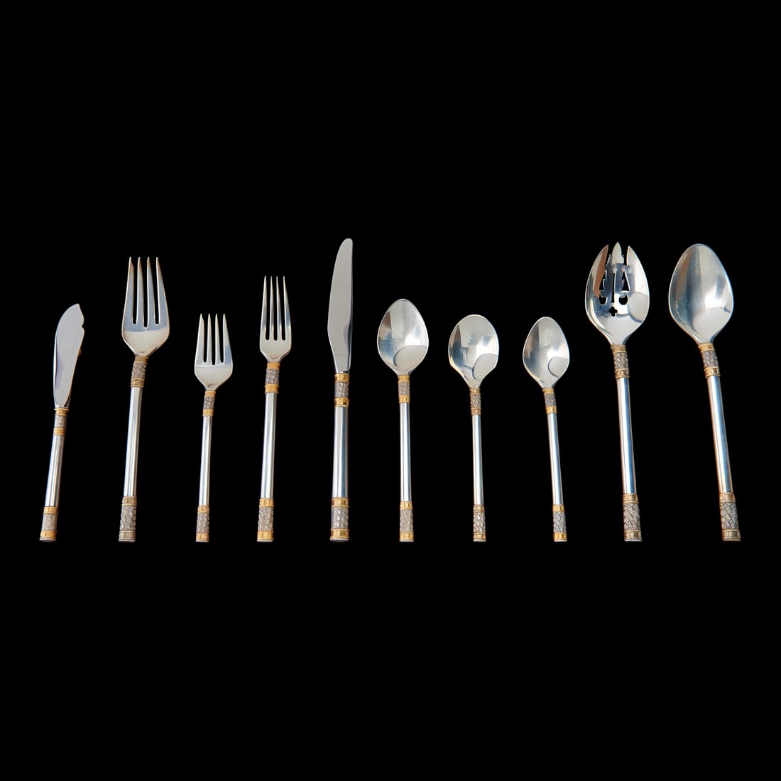 Wallace "Golden Aegean Weave" Pattern Sterling Silver Flatware Service: Wallace "Golden Aegean Weave" Pattern Sterling Silver Flatware Service, with gold and checkered silver decorative bands. Comprising 12 dinner knives, 9 1/4" L.,12 dinner forks, 8" L., 12 salad forks, 