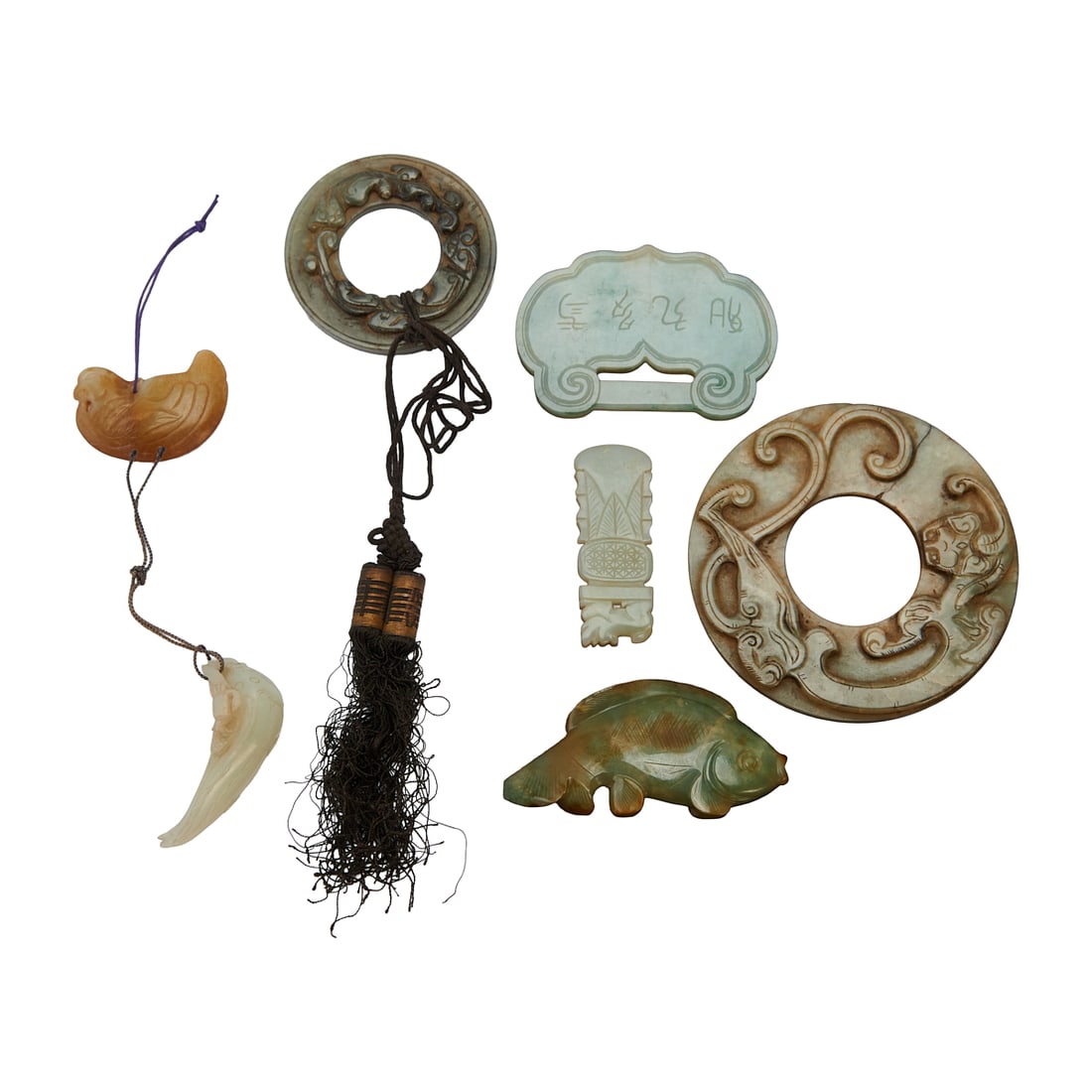 Group of Jade and Jadeite Pendants and Bi Disks: Group of Jade and Jadeite Pendants and Bi Disks.{Largest: Diameter 4 1/4inches (10.5 cm), Smallest: Length2 inches (5.2 cm}.