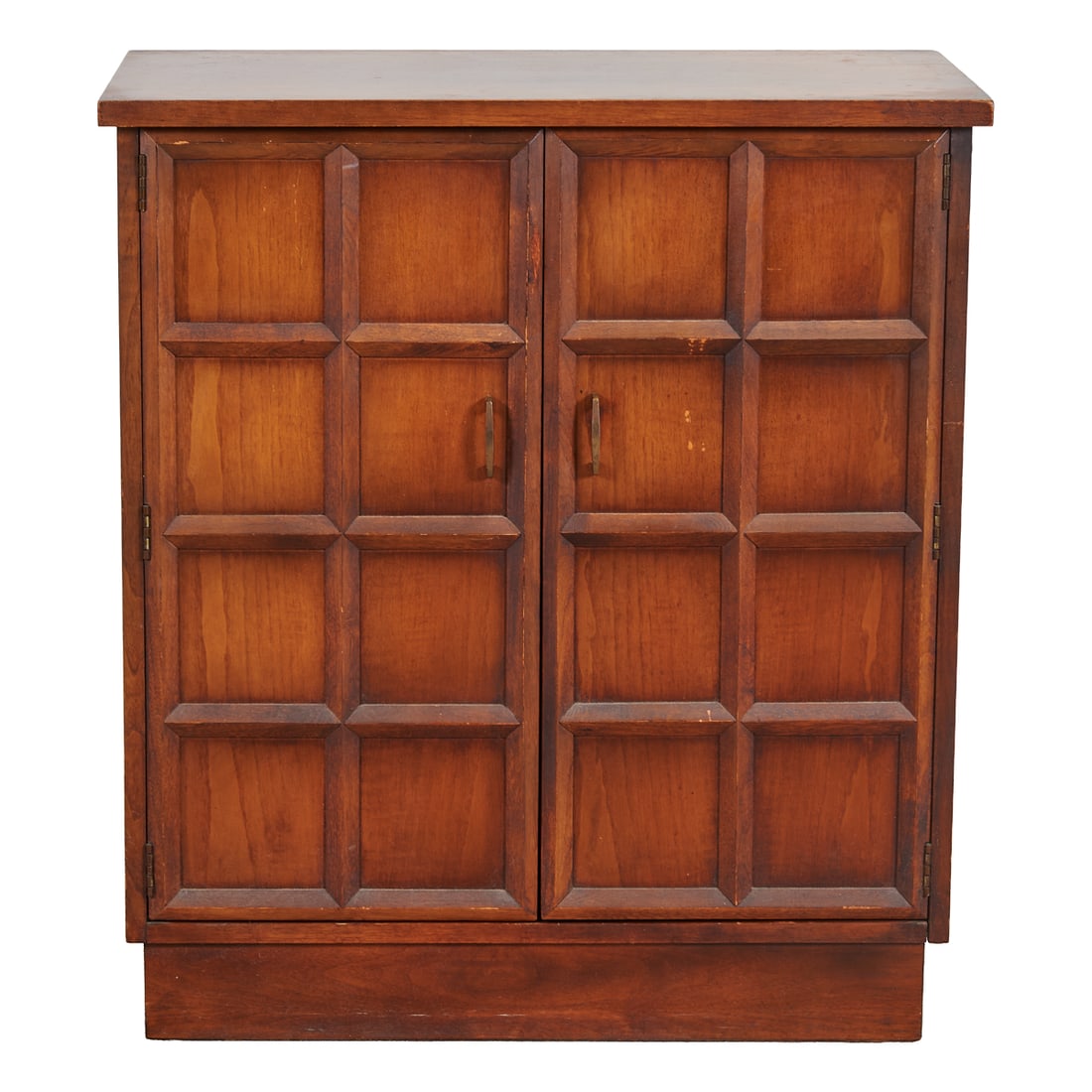 Mid Century Walnut Flip Top Bar Cabinet, top overcast above blind doors with grid design, revealing: Mid Century Walnut Flip Top Bar Cabinet, top overcast above blind doors with grid design, revealing one shelf, and each door with plastic bottle holders. Gilt brass handles to doors.. Circa 1980 - 198