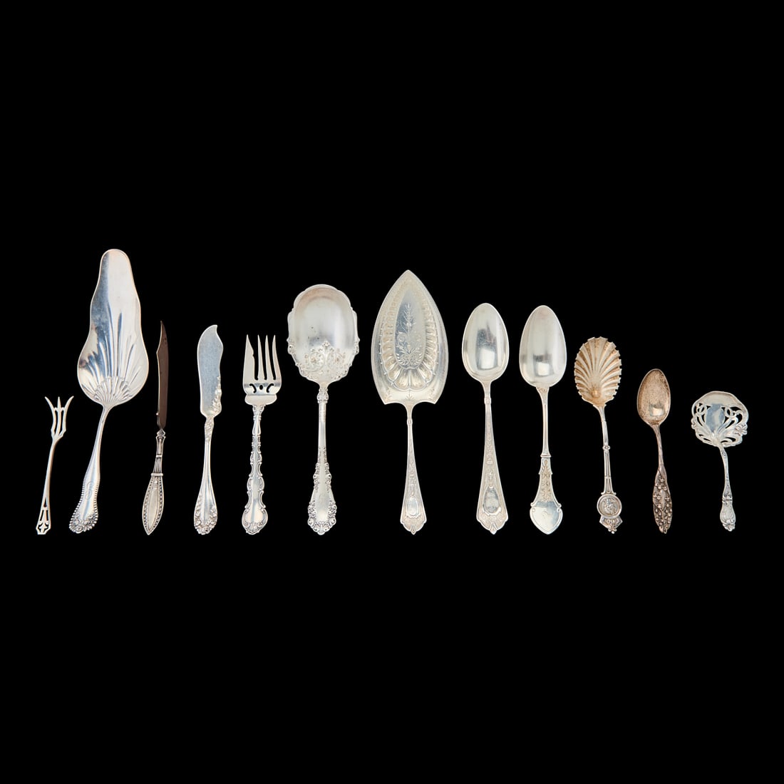 Collection of American Sterling, Coin and Silverplate Serving Articles, including two serving spoons (1 of 5)