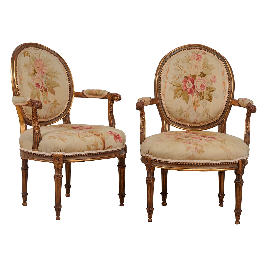 Pair of Louis XV Parcel Giltwood Fauteuils..The wood frames carved with foliate, floral, scrollwork: Pair of Louis XV Parcel Giltwood Fauteuils..The wood frames carved with foliate, floral, scrollwork and notched designs and bead molding, and painted in green, red, and gilt, the upholstery woven with