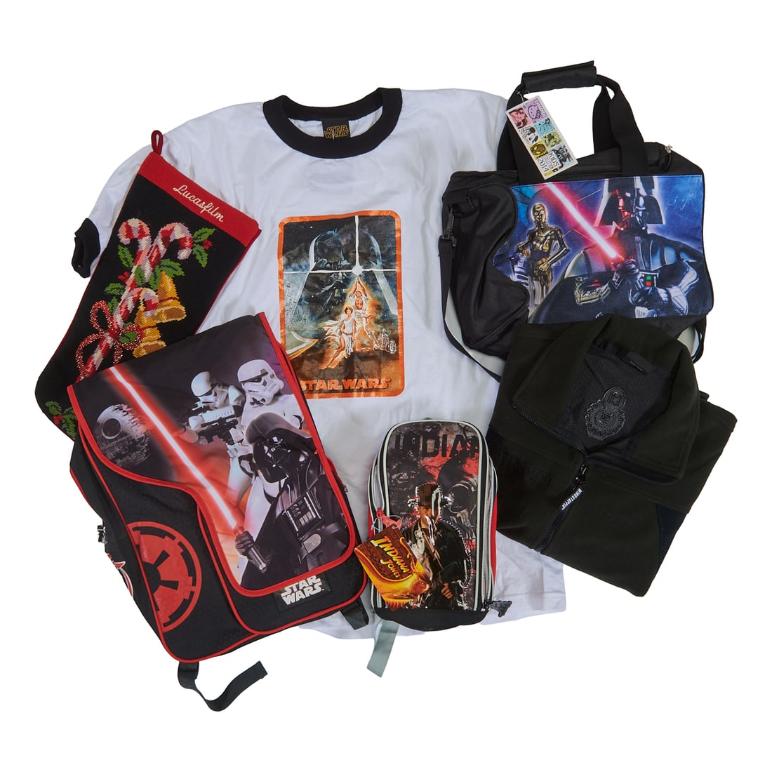 Collection of Lucas Films, Jacket, Bags, Shirt; including a zip-up fleece Star Wars Episode III: Collection of Lucas Films, Jacket, Bags, Shirt; including a zip-up fleece Star Wars Episode III jacket, size L; white Star Wars t-shirt size L, small Indiana Jones backpack, larger Star Wars backpack 