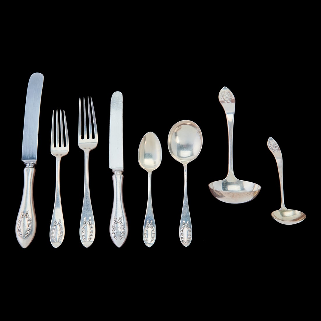 Shreve and Co Sterling Silver Napoleonic Pattern Flatware Service.. Comprising eight dinner knives, (1 of 4)