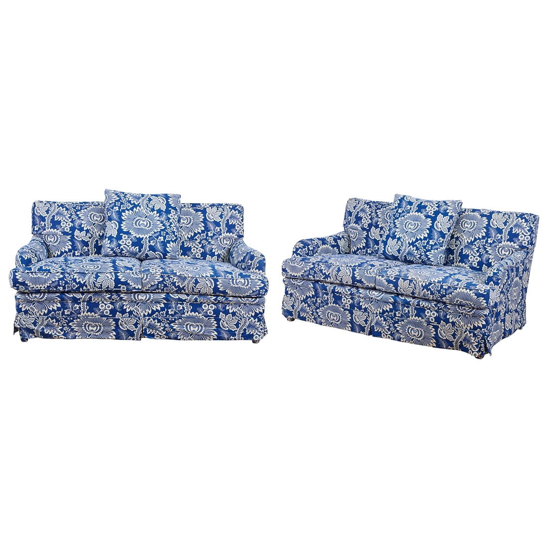 Pair of Sofas with Two Bolts of Yves Holard Printed Cotton Fabric, the two love seats each with two: Pair of Sofas with Two Bolts of Yves Holard Printed Cotton Fabric, the two love seats each with two cushions to seats and backs, the frames with low slung arms over straight fronts. Upholstered in