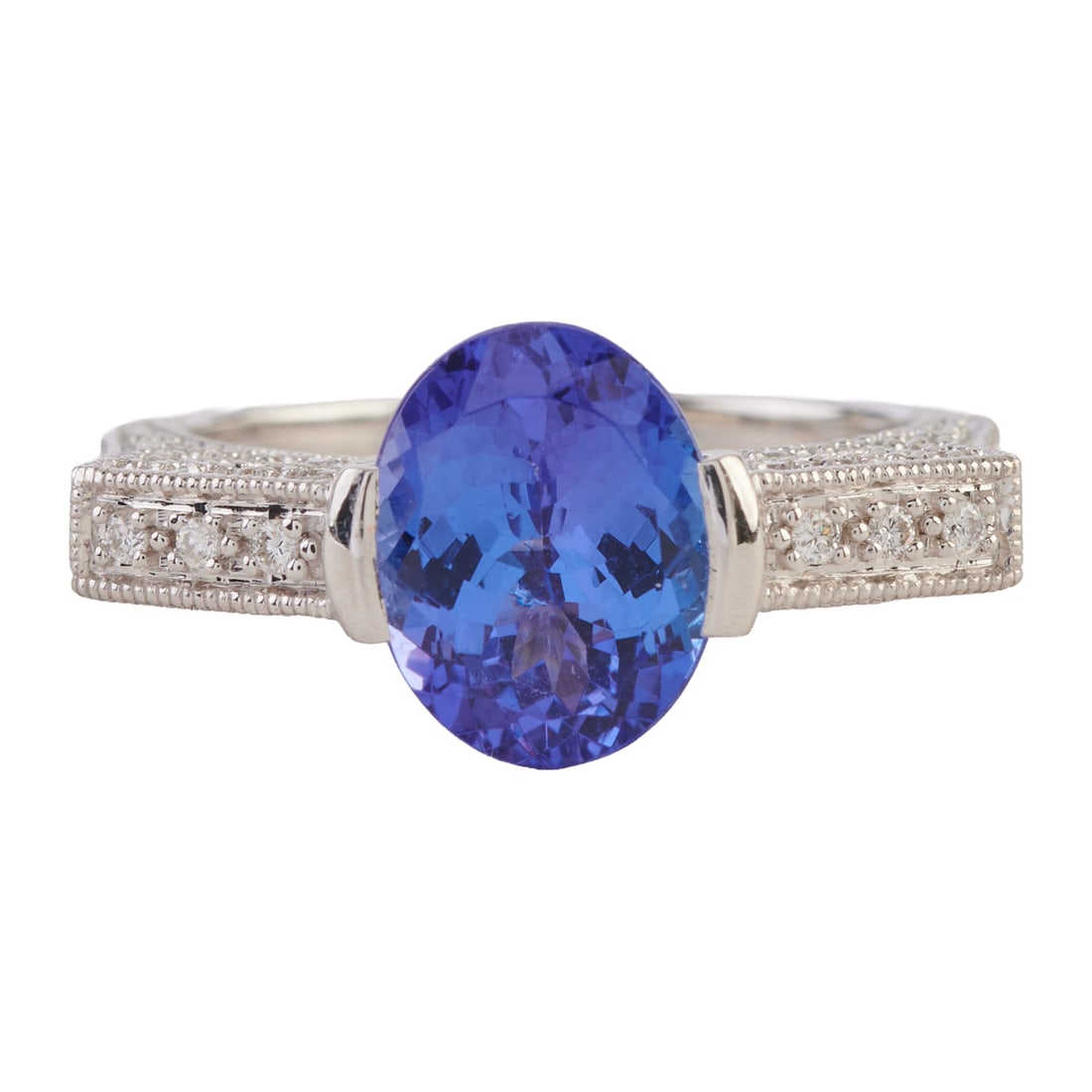 Tanzanite, Diamond, 18k White Gold Ring. Featuring one oval-cut tanzanite weighing approximately (1 of 4)